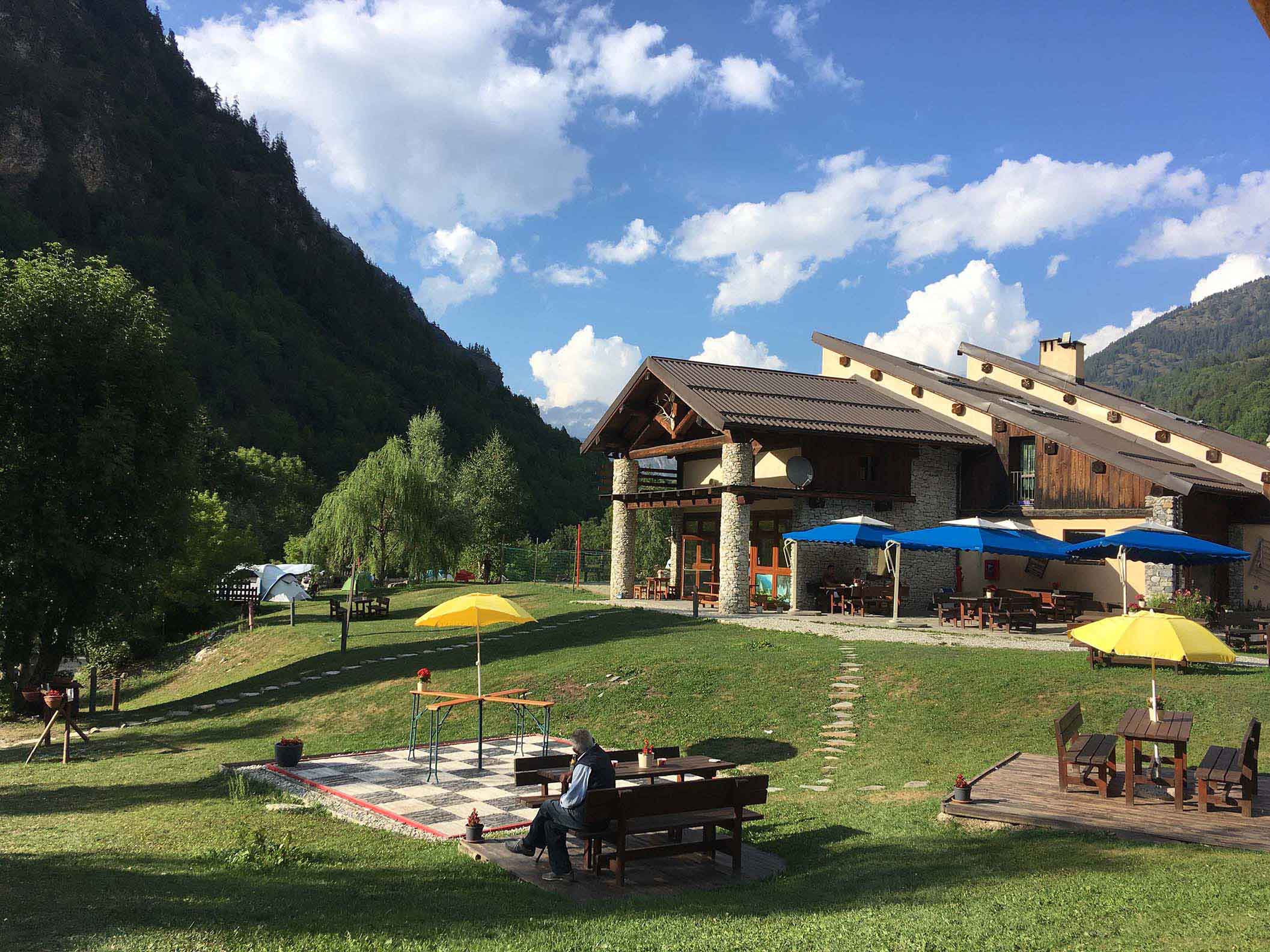 sunny bar terrace of camping Lou Dahu
